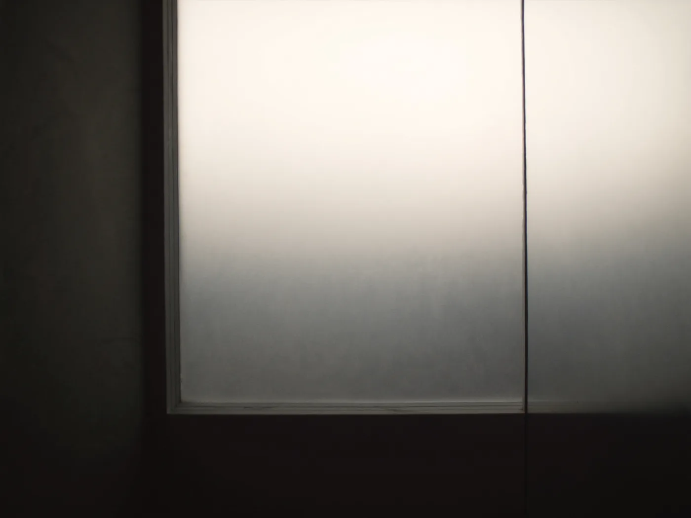Frosted satin glass glowing evenly with diffused tropical daylight